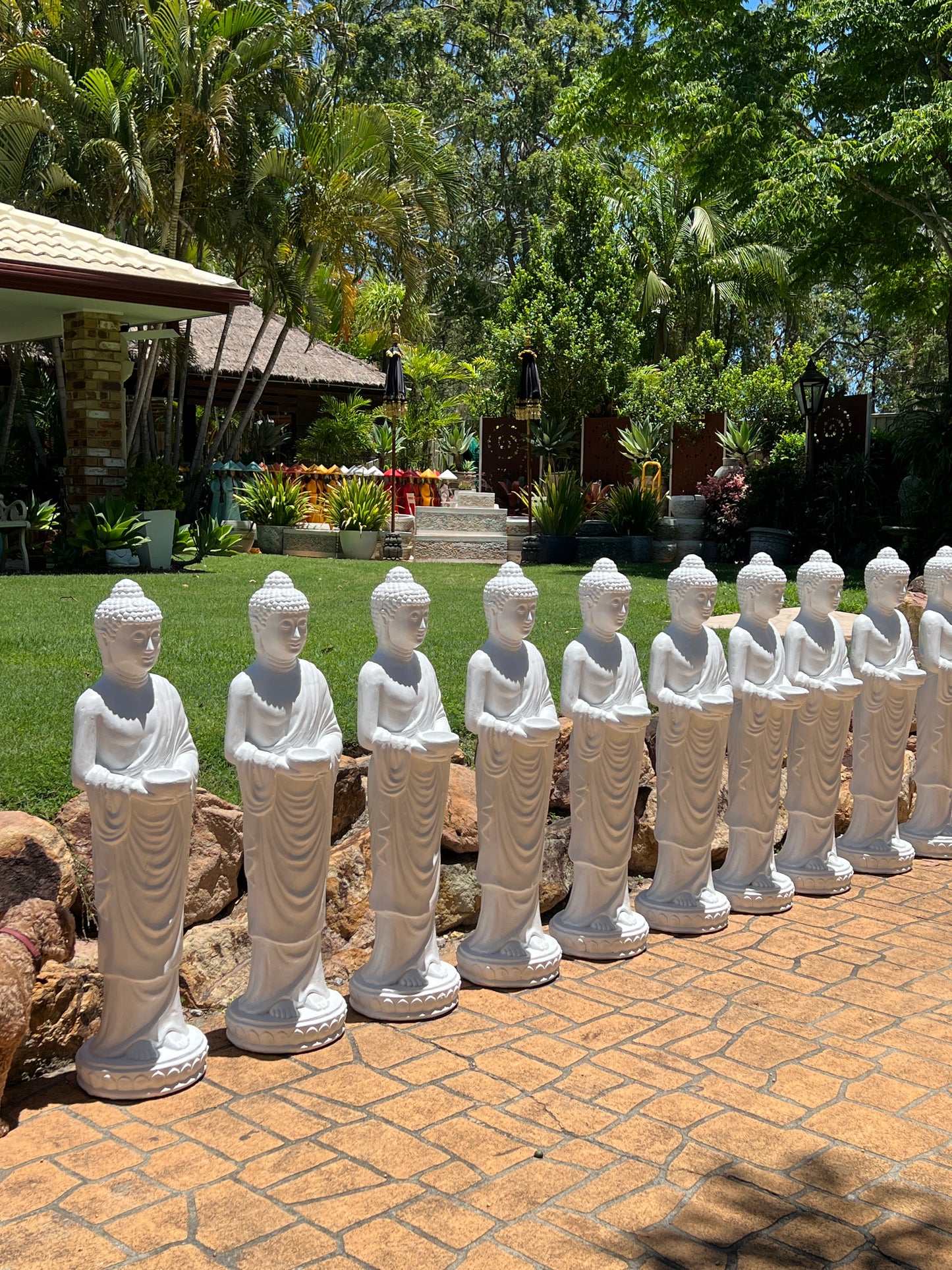 White Statue Standing Holding Cup